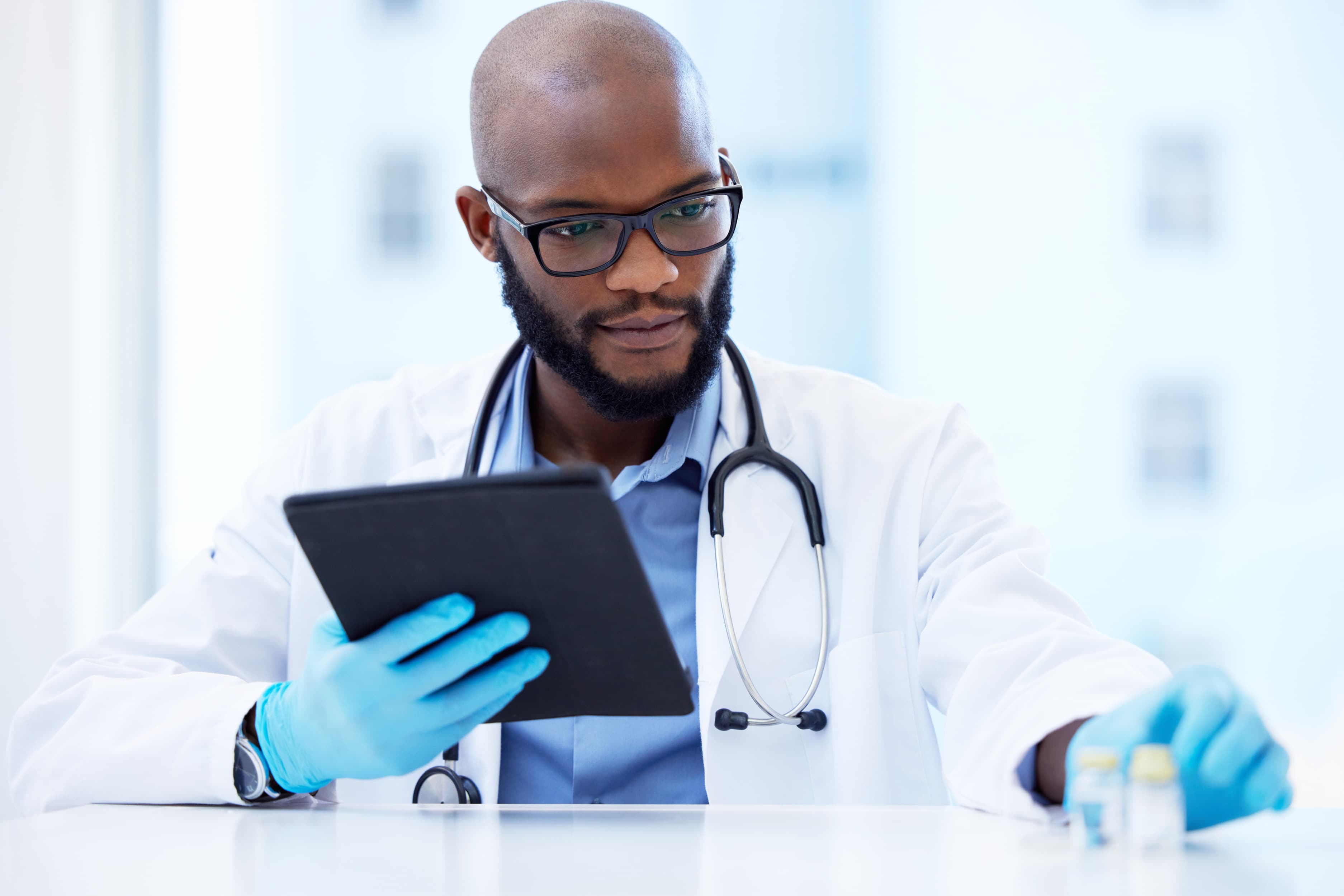 Doctor reviewing content on tablet